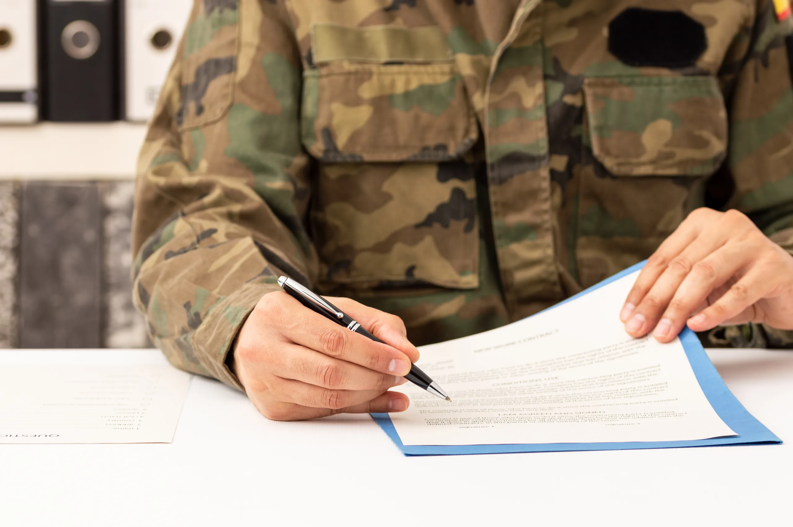 Close,Up,Of,Executive,Military,Man,Hands,Signing,Contract,On Defence_4