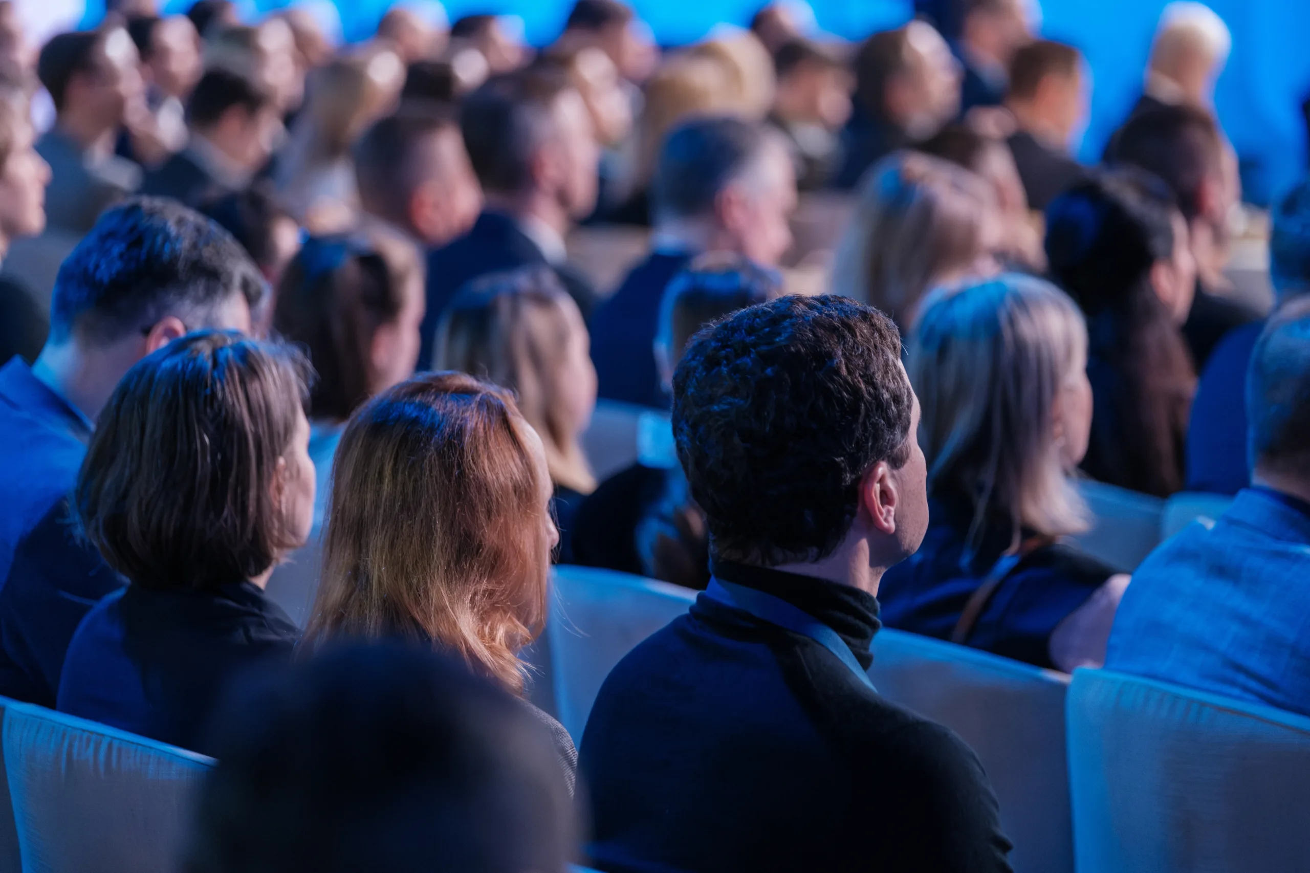 Diverse,Audience,Of,Professionals,Intently,Listens,To,A,Speaker,At Conferences_7